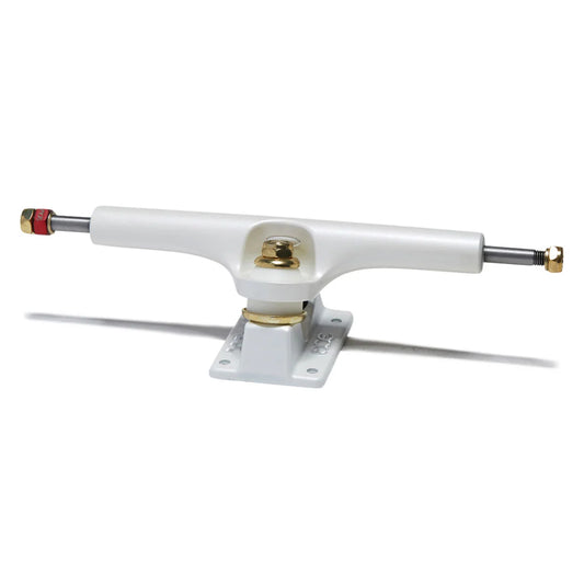 A single skateboard truck with a white polyurethane frame, gold-toned metal hardware, and silver metal axles with red and gold end caps, shown on a white background with a soft shadow.