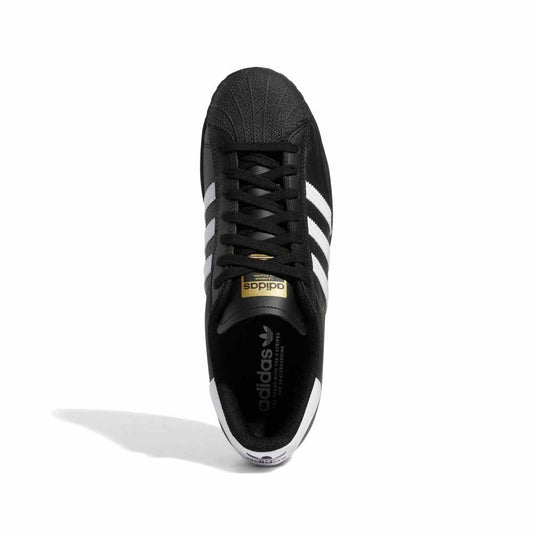 Black Adidas sneaker with white stripes on a white background