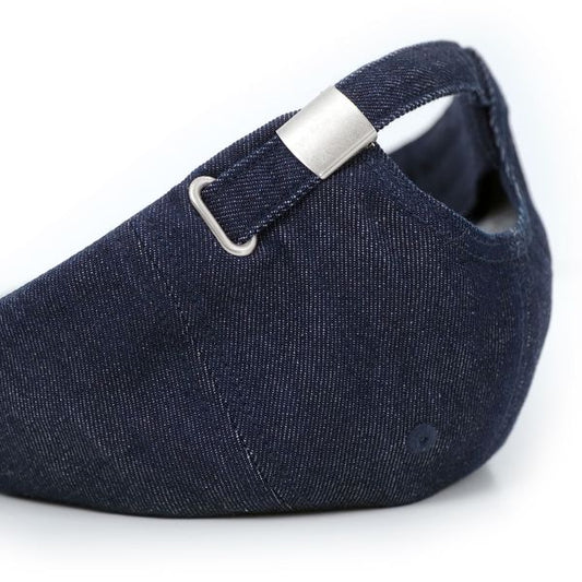 Navy blue cap with a silver buckle on a white background