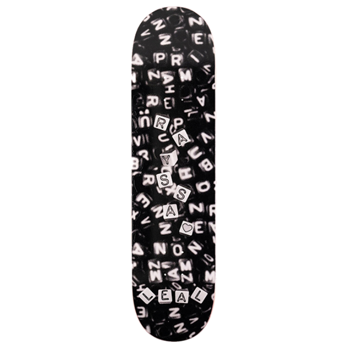 Black skateboard deck with white text pattern on a white background