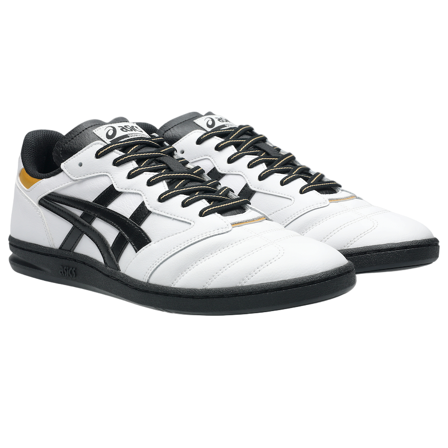 White sneakers with black accents on a gray background