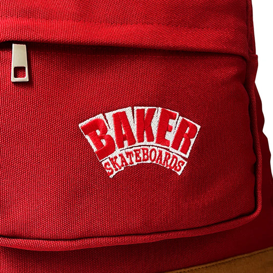 Red backpack with 'Baker Skateboards' logo on a white background