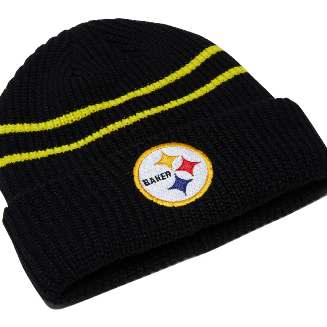 A black knit beanie hat with two yellow stripes and a circular Pittsburgh Steelers patch on the front cuff. The patch features the name 'BAKER' and the Steelers logo.