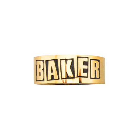 Gold bracelet with 'BAKER' engraving on a white background
