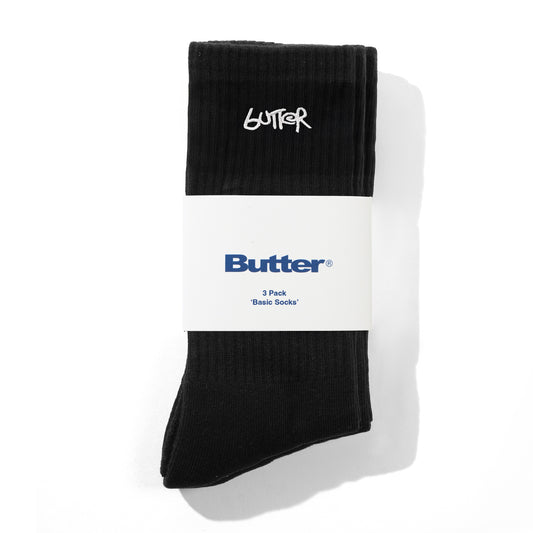 Black socks with 'Butter' branding on a white background