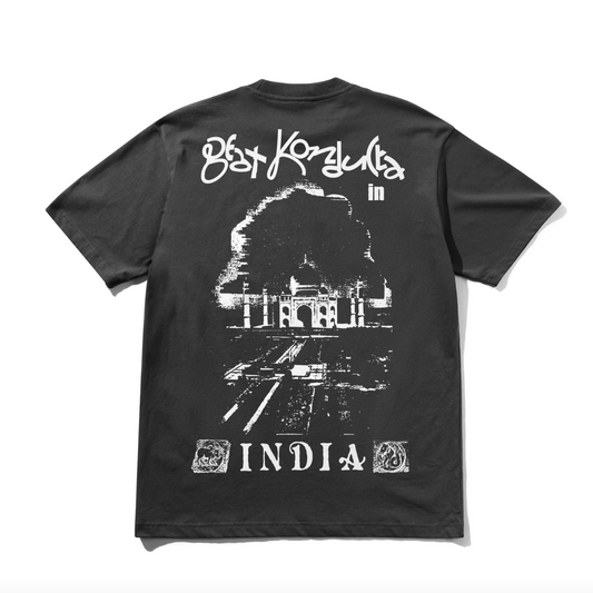 Black t-shirt with white graphic design and text on a white background