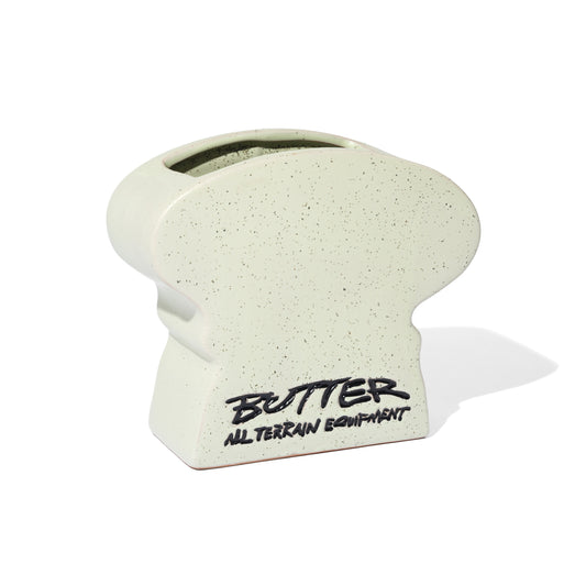 White textured object with 'Butter All Terrain Equipment' branding on a white background