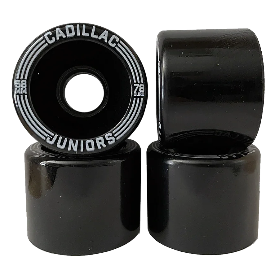 Black skateboard wheels with 'Cadillac Juniors' branding on a white background