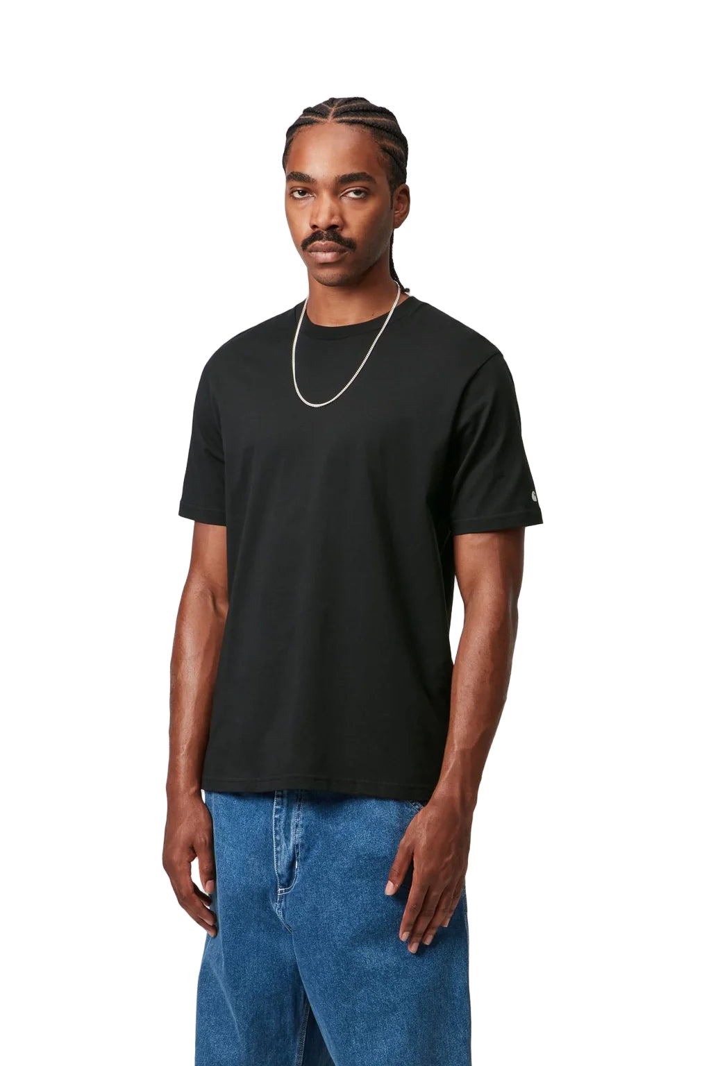 Man wearing a black t-shirt and blue jeans on a white background