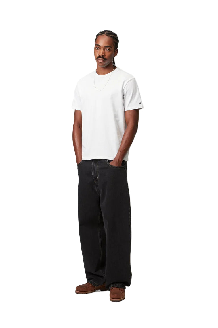 Man wearing a white t-shirt and black pants on a white background