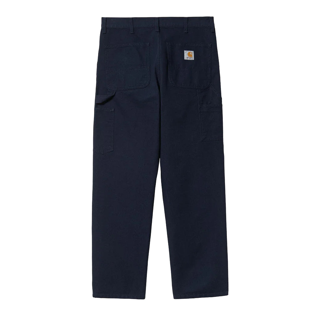 Navy blue pants with a brand logo on a white background