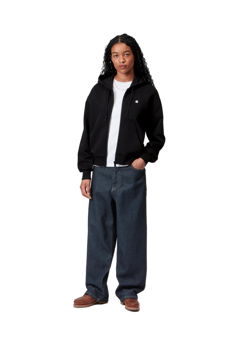Person wearing a black jacket, white shirt, and dark pants on a white background