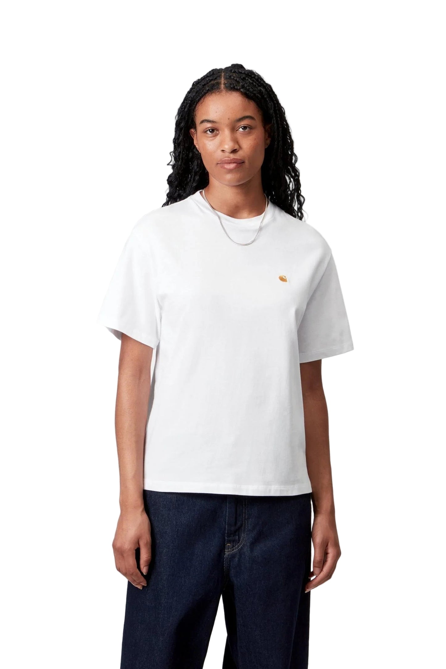 Person wearing a white t-shirt with a small logo on a plain background