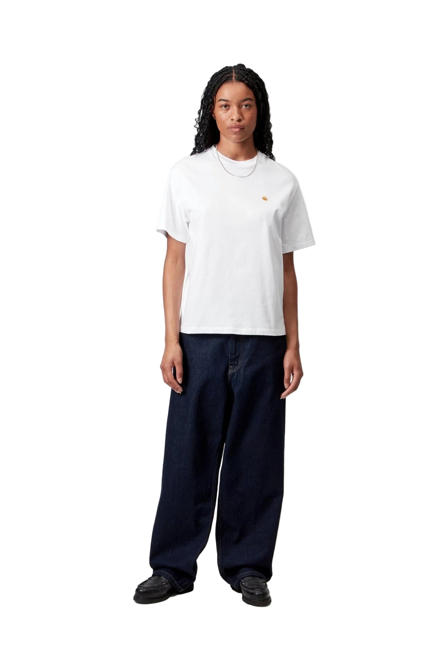 Person wearing a white t-shirt and dark pants on a white background