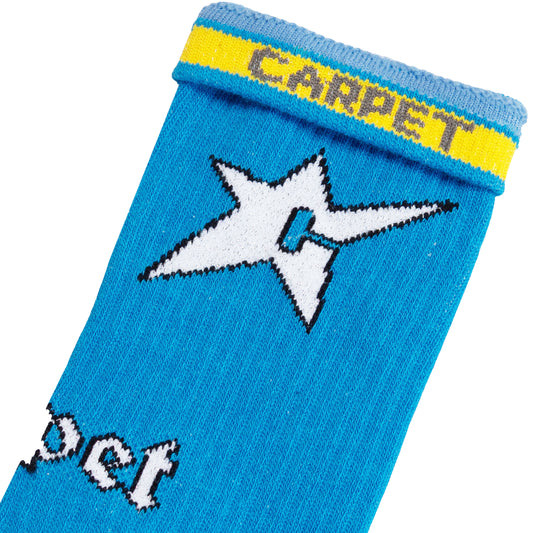 Blue sock with white star design and yellow band labeled 'Carpet' on a white background