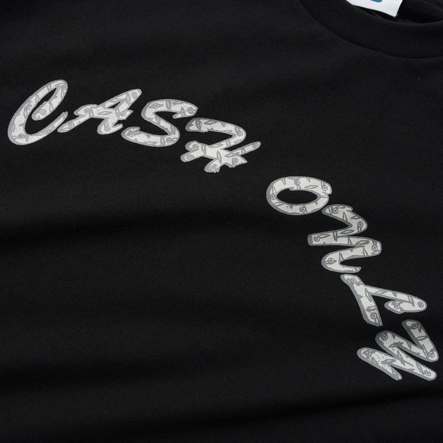 Black t-shirt with 'Cash Only' text design on a plain background