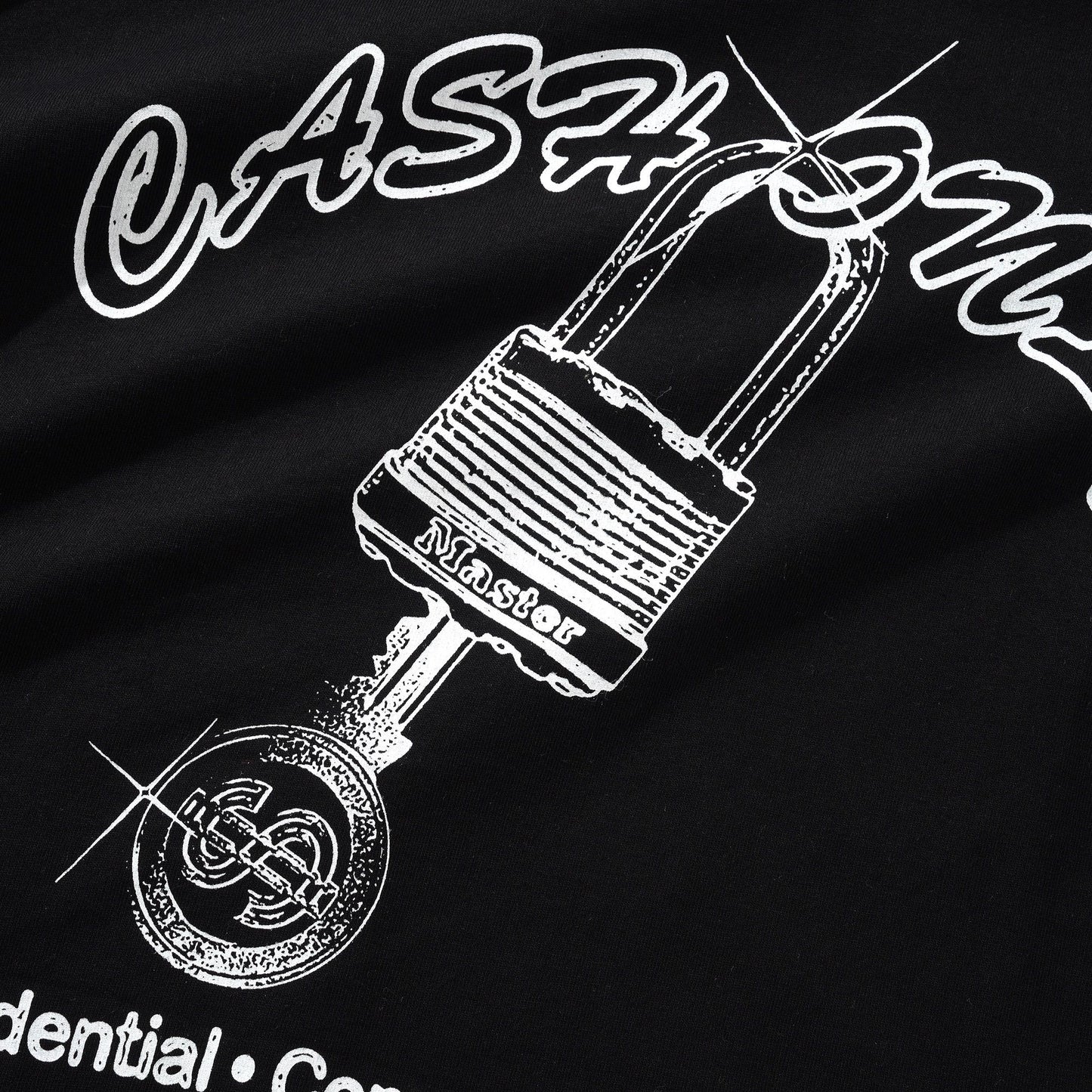 Black shirt with white graphic of a padlock and key, and text on a dark background