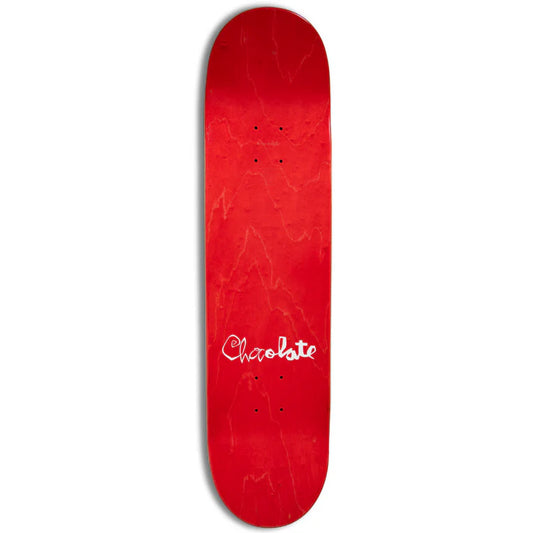 Red skateboard deck with 'Chocolate' logo on a white background