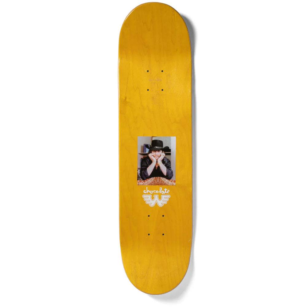 Yellow skateboard deck with a printed design on a white background