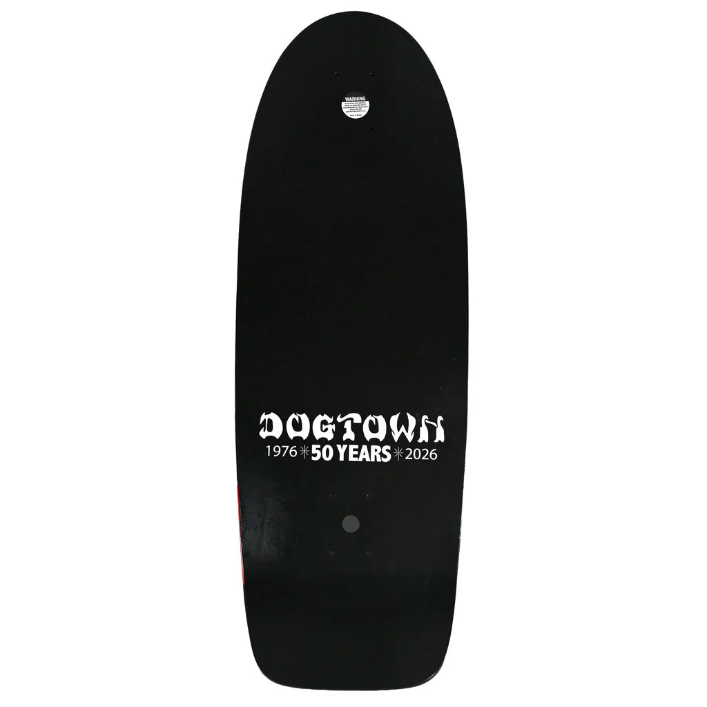 Black skateboard deck with 'Dogtown 50 Years' text on a white background
