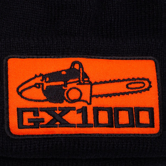 Embroidered patch of a chainsaw with 'GX1000' text on an orange background