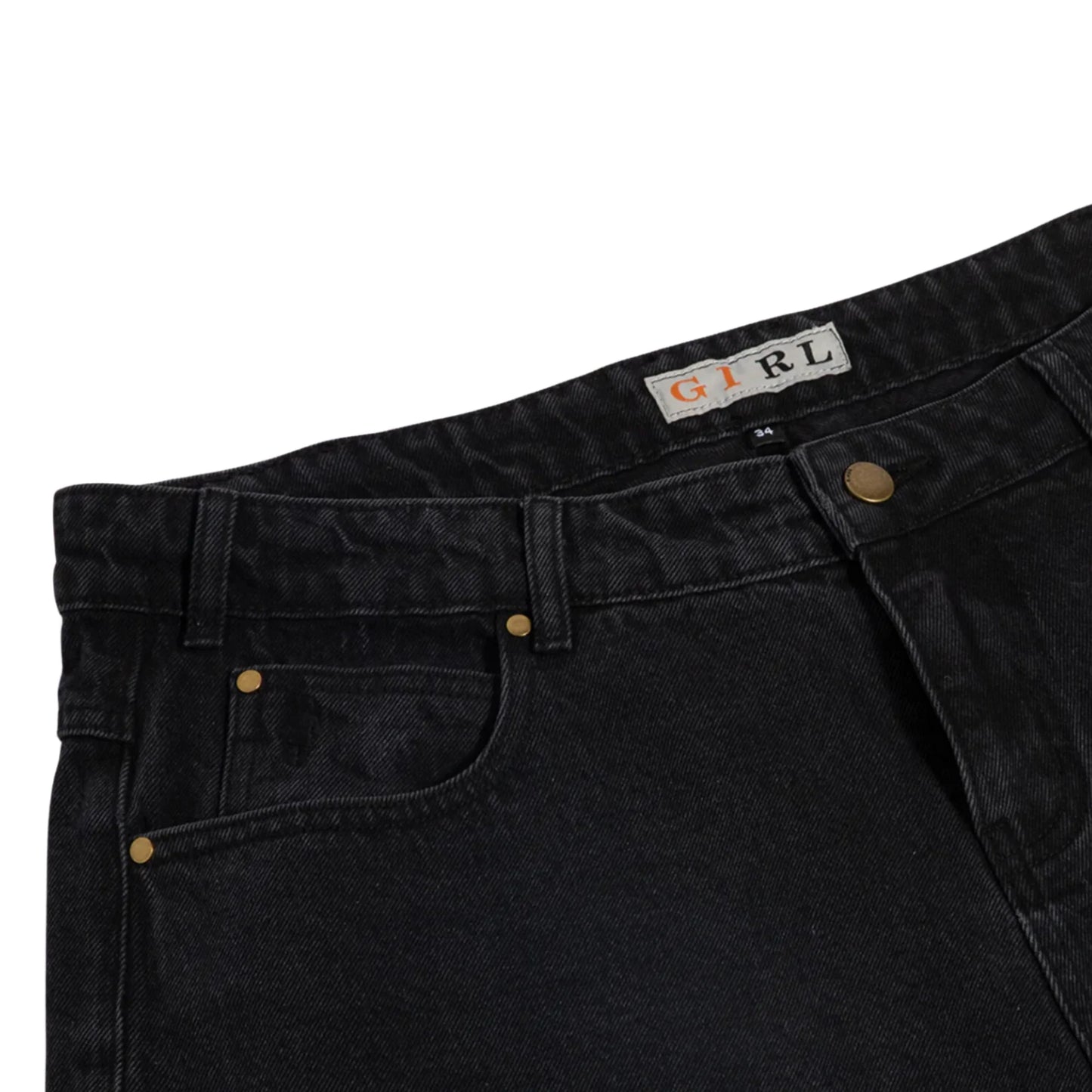 Close-up of black pants with a brand label on a white background