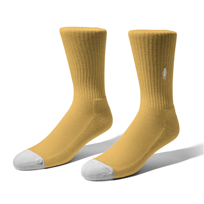 Pair of mustard yellow socks with white toes and heels on a white background