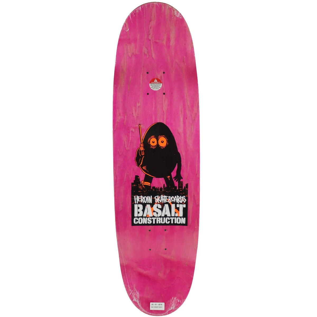 A pink skateboard deck featuring a black cartoon character holding a paintbrush and a large Basalt Construction logo graphic near the bottom.