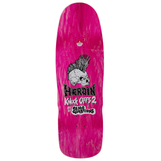A pink skateboard deck with a marbled finish, featuring a skull with a black and white mohawk, the text 'heroin Knock Off 2', and 'craig Questions' on a white background.