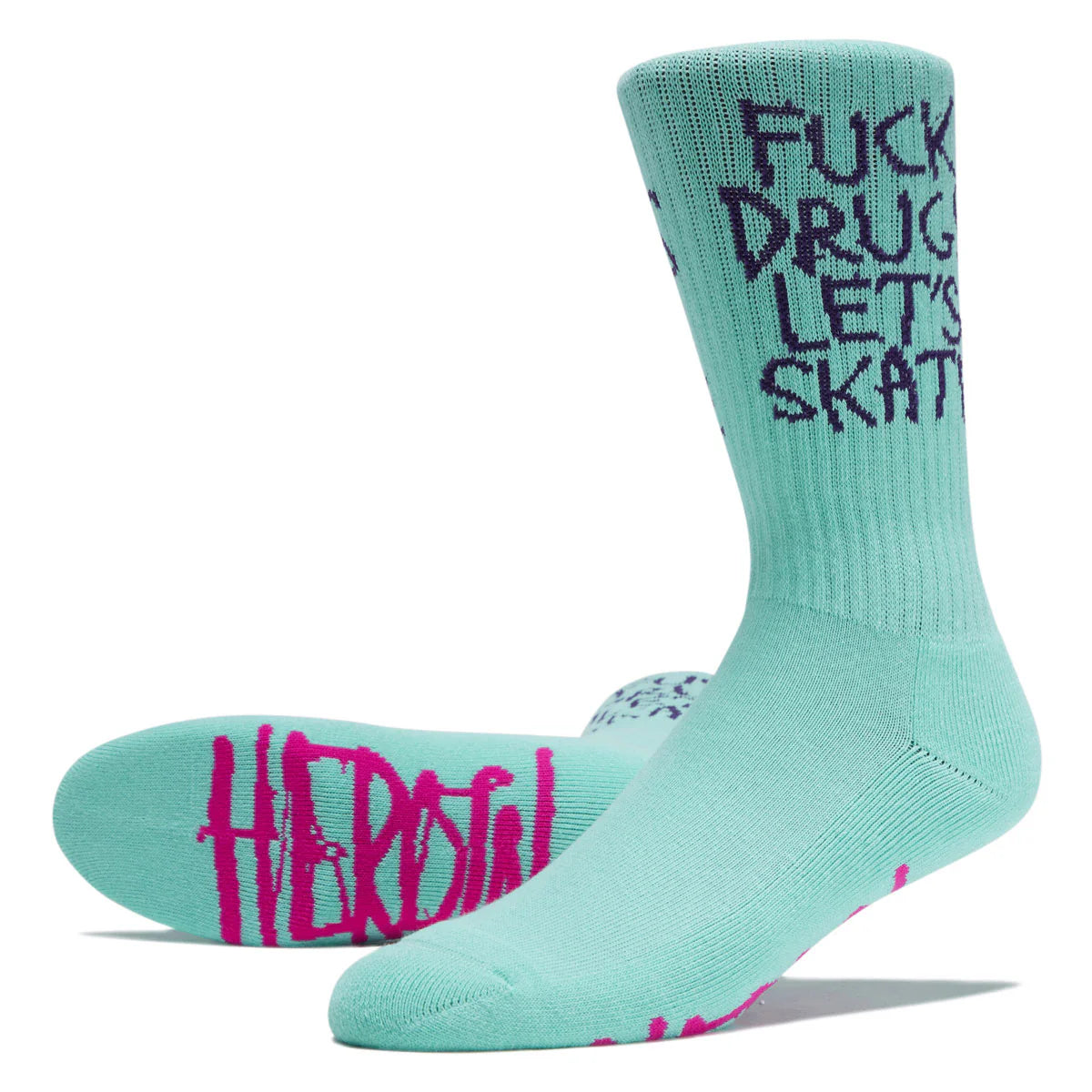 A pair of mint green crew socks with bold graphic text. One sock displays the text 'FUCK DRUG LET'S SKATE' in black on the leg, and the other shows 'HEROIC' in bright pink on the foot.