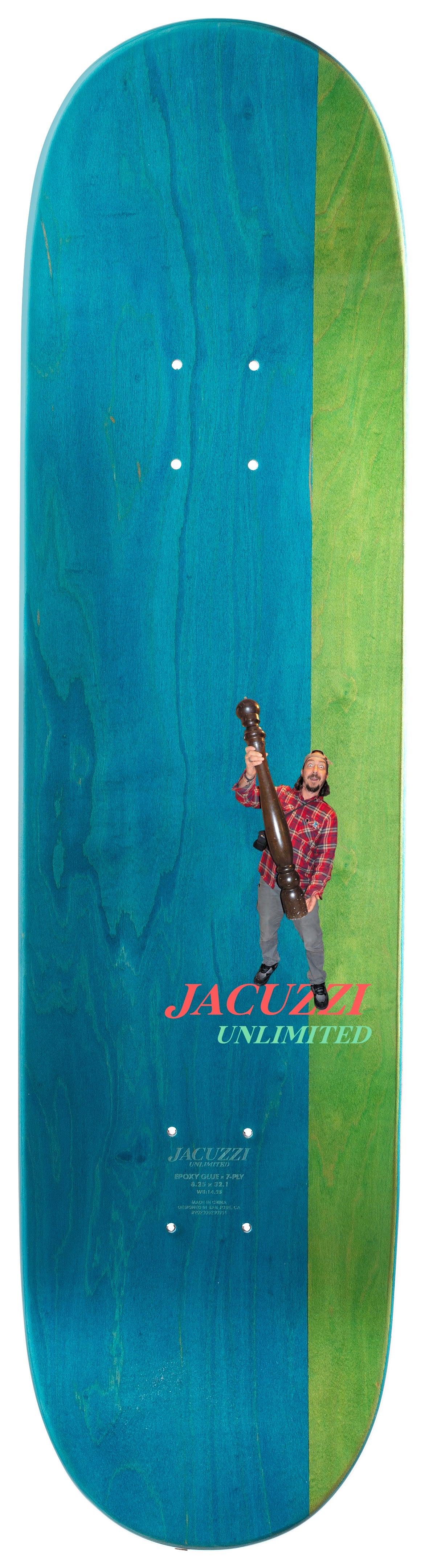 Skateboard deck with a graphic of a person holding a gun, set against a blue and green striped background. Brand 'Jacquie' is visible.