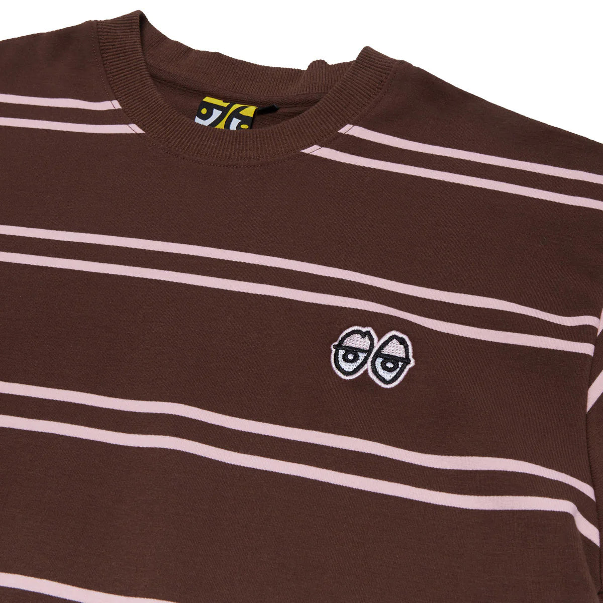 Brown striped shirt with a small logo on a white background