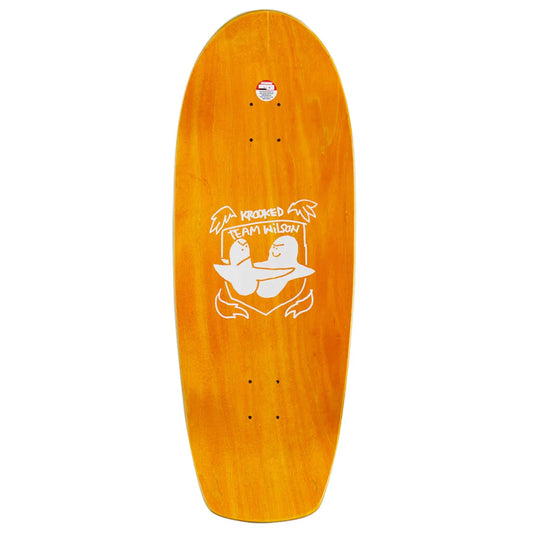 An orange wood deck skateboard shown from the bottom side, featuring a white graphic of two ducks with the text 'kROOKED TEAM wilson' on a clean white background.