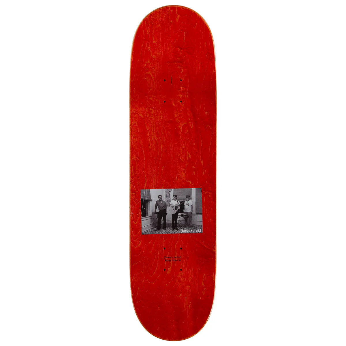 Red skateboard deck with a black and white photo in the center on a white background