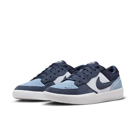 Pair of blue and white sneakers with a visible brand logo on a white background