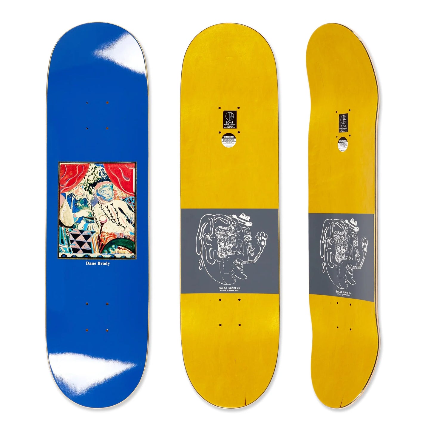 Three skateboard decks displayed side by side with artistic designs on a white background.