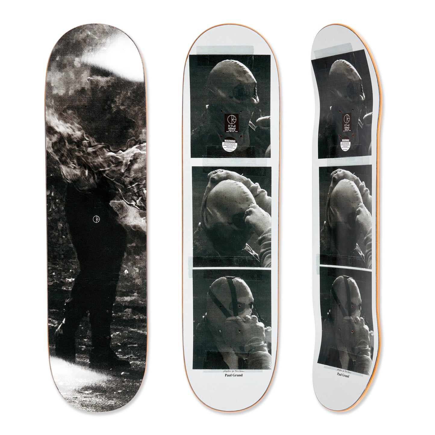 Three skateboard decks with black and white images of a person underwater.