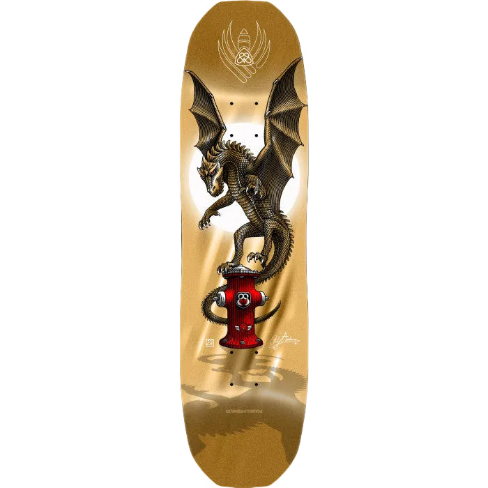 Skateboard deck with a dragon design on a gold background
