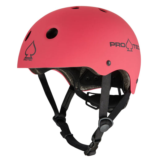 Pink helmet with black straps on a white background