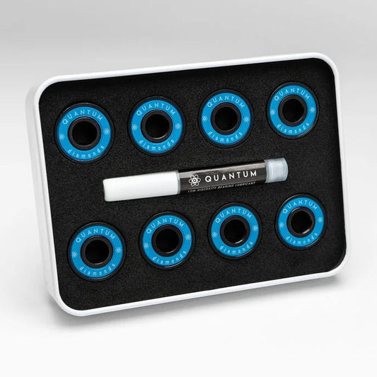 Set of blue circular components on a black tray with a white marker labeled 'Quantum' on a light gray background