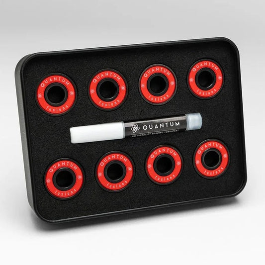 Set of red circular components on a black tray with a white marker labeled 'Quantum' on a light gray background