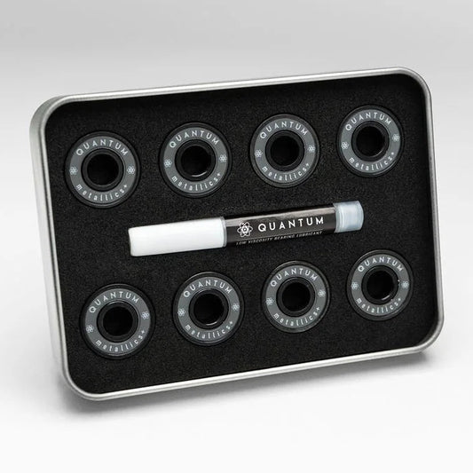 Set ofQuantum skateboard bearings on a black tray with a white background