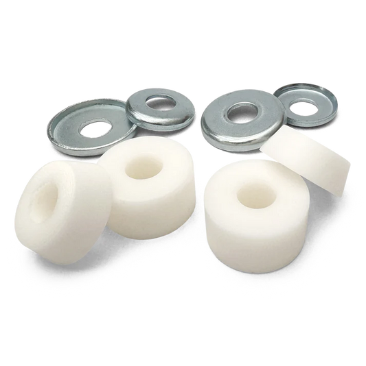 Set of white bushings and metal washers on a white background