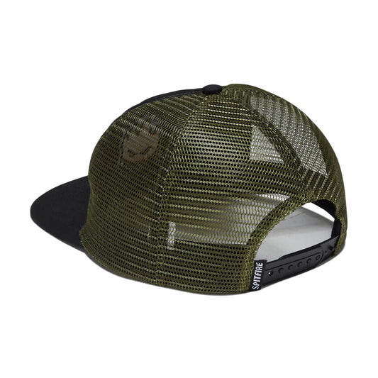 An olive green and black trucker hat shown from a rear three-quarter angle on a white background, featuring a black flat brim, black mesh back panels, and a black adjustable snap closure.