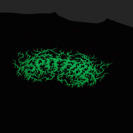 A black crewneck t-shirt featuring a glowing neon green thorny graphic logo across the chest, shown against a dark background.
