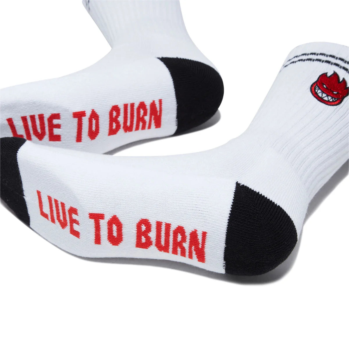 White crew socks with black toe and heel sections, featuring the red text 'LIVE TO BURN' on the sole and a small red devil logo on the side.
