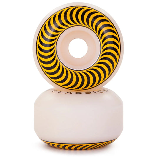 A pair of skateboard wheels stacked vertically on a white background. The top wheel is shown from the face, featuring a cream-colored urethane body with a bold yellow and black spiral pattern around the inner ring.