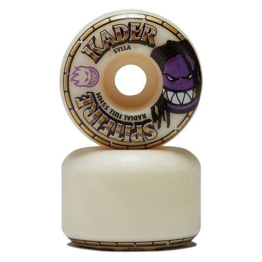 A Kader Syla skateboard wheel shown upright on top of its matching cream-colored base, featuring a purple monster face graphic and gold accents on a white background.