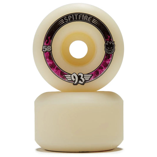 Two Spitfire skateboard wheels stacked vertically on a white background, featuring a cream-colored urethane body with a black, pink, and white graphic ring on the top wheel.
