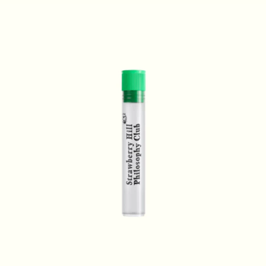 Small cylindrical container with a green cap on a white background